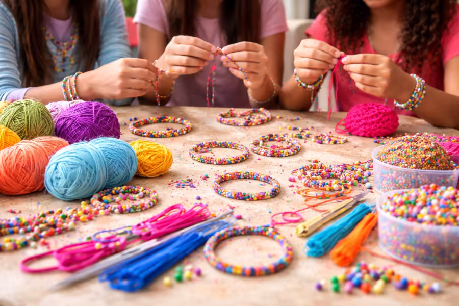 Students doing fiber arts around a table